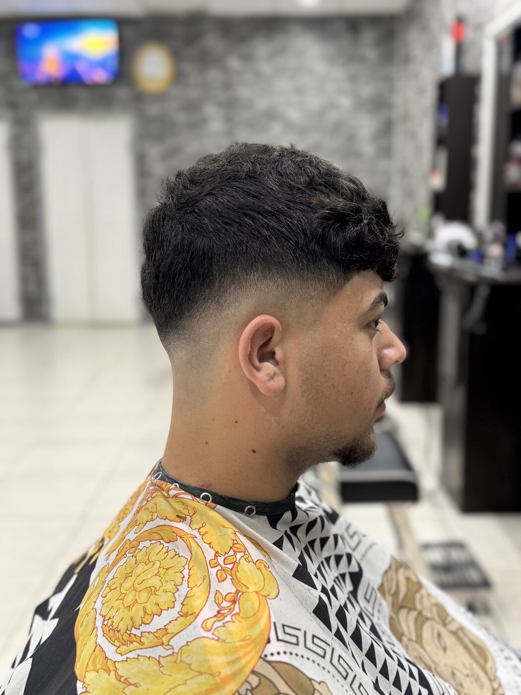 Low fade, textured top, cut at Nextcut Barber Shop