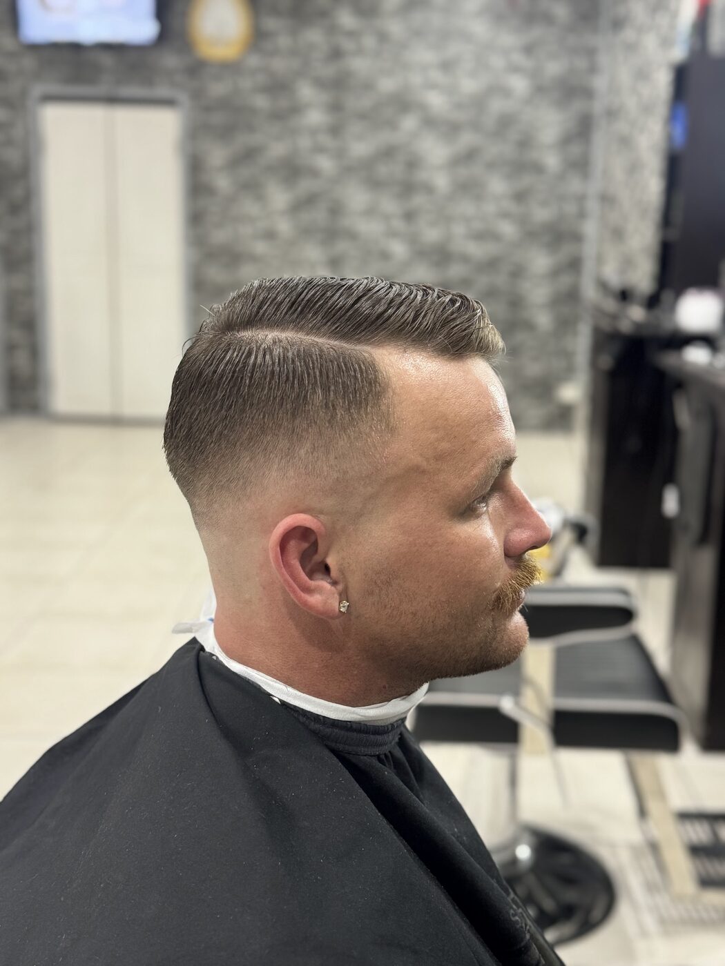 Side part and fade, cut at Nextcut Barber Shop