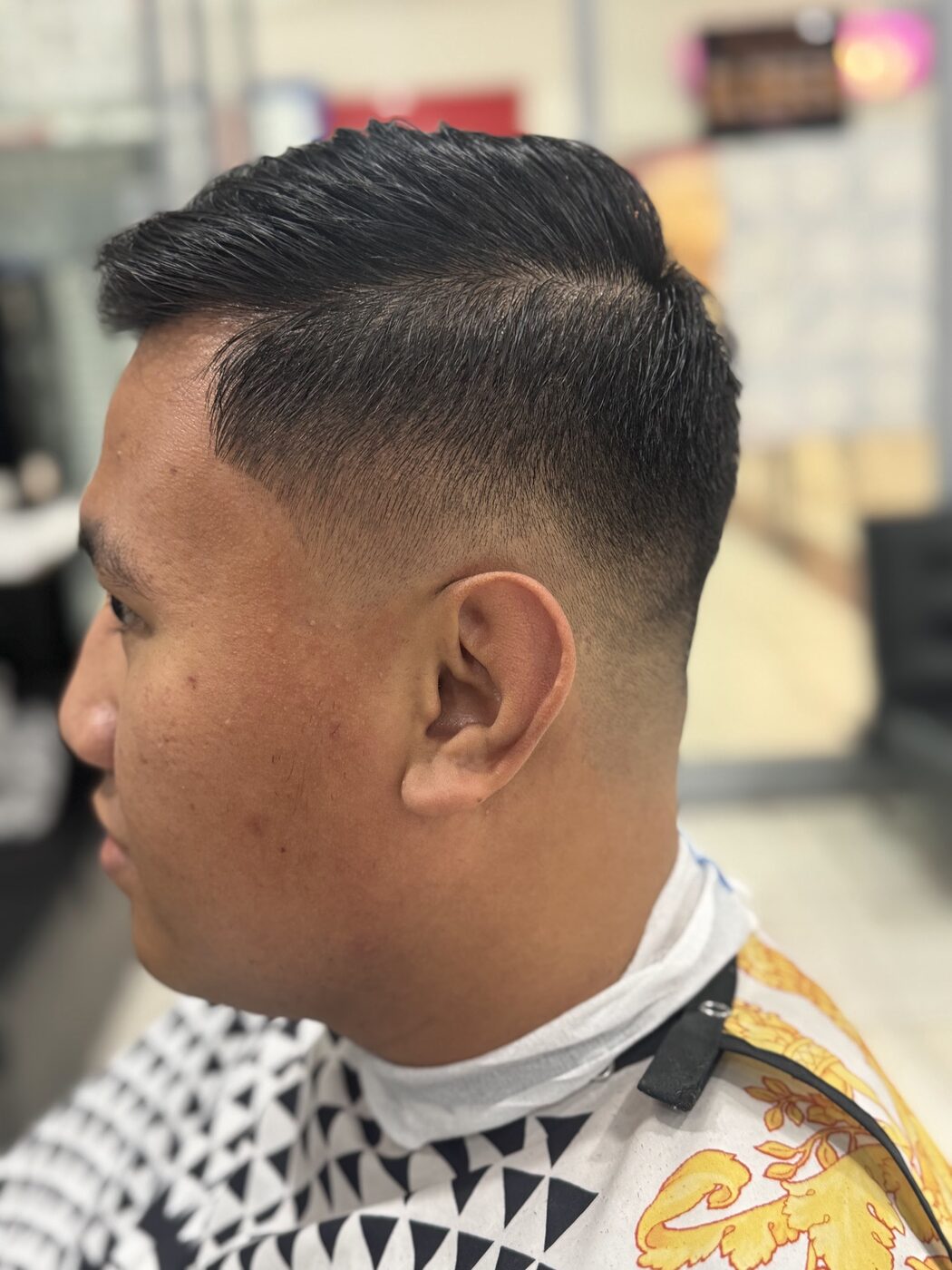 Pompadour with a taper, cut at Nextcut Barber Shop